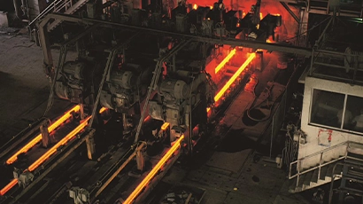 Overhead view of molten iron flowing in a steel mill